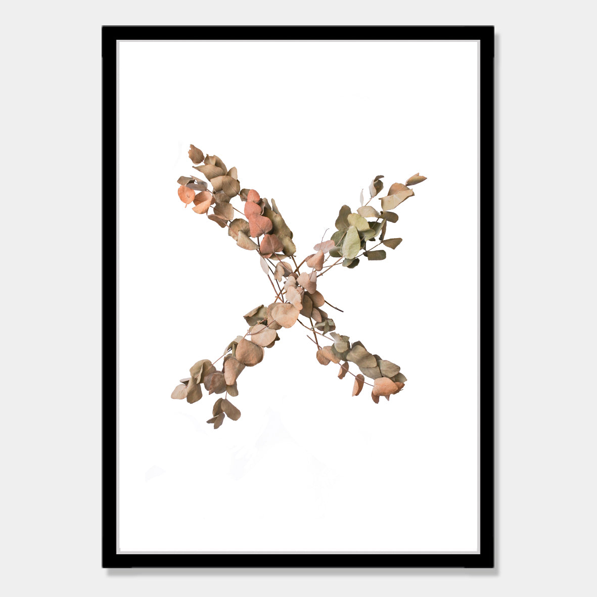 Photographic art print of dried leaves in a X shape by Bon Jung. Printed in New Zealand by endemicworld and framed in black.