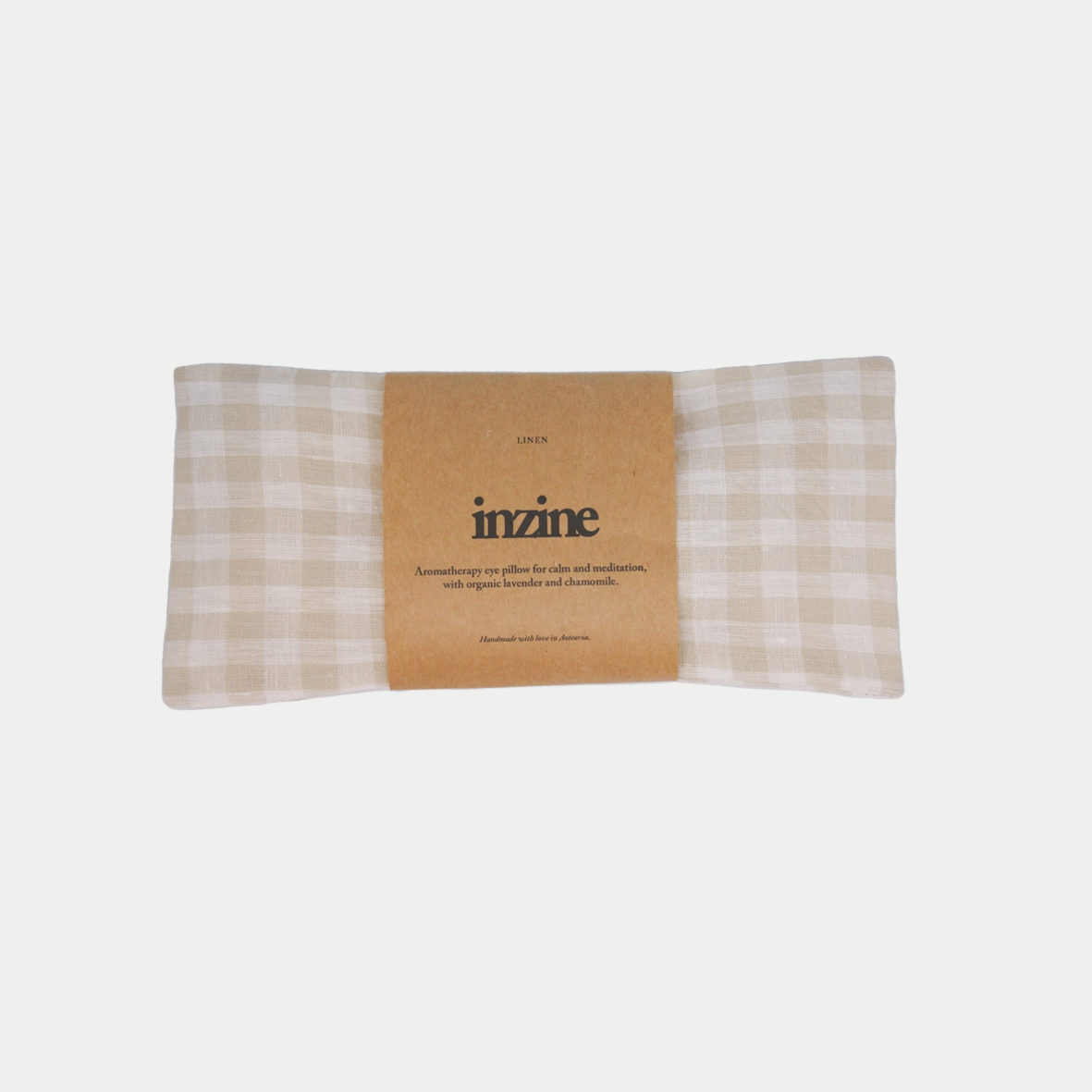 Handmade linen eye pillow in gingham alabaster, filled with organic chamomile and lavender and linseed.
