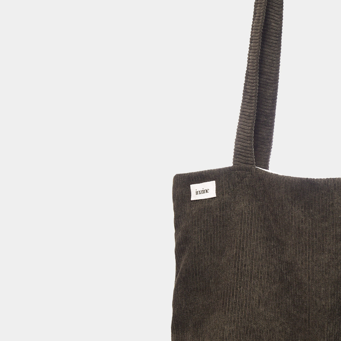 Corduroy tote bag, forest green colour with green inzine label. Hand made in New Zealand.