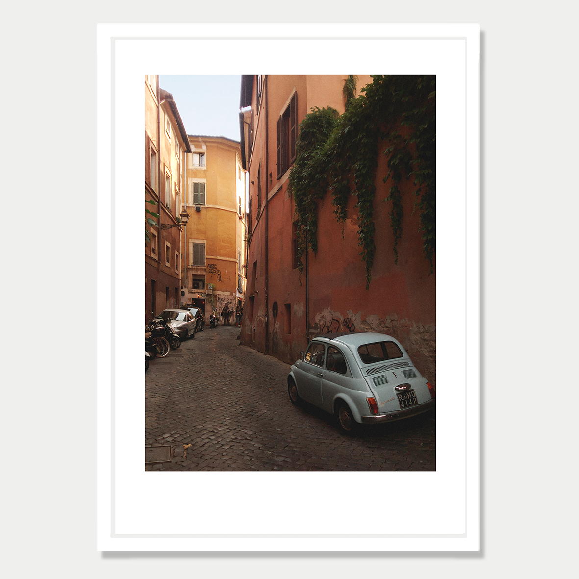 Little Car in a Backstreet of Trastavere, Rome Still Life Photographic Art Print in a Skinny White Frame
