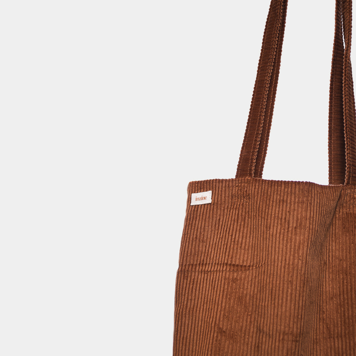 Corduroy tote bag, toffee brown colour with brown inzine label. Hand made in New Zealand.