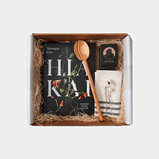 Gift set with Hiakai by Monquie Fiso, Nōla candle - Olive & Thyme hand crafted in New Zealand, Olive wood spoon, and handwoven cotton tea towel
